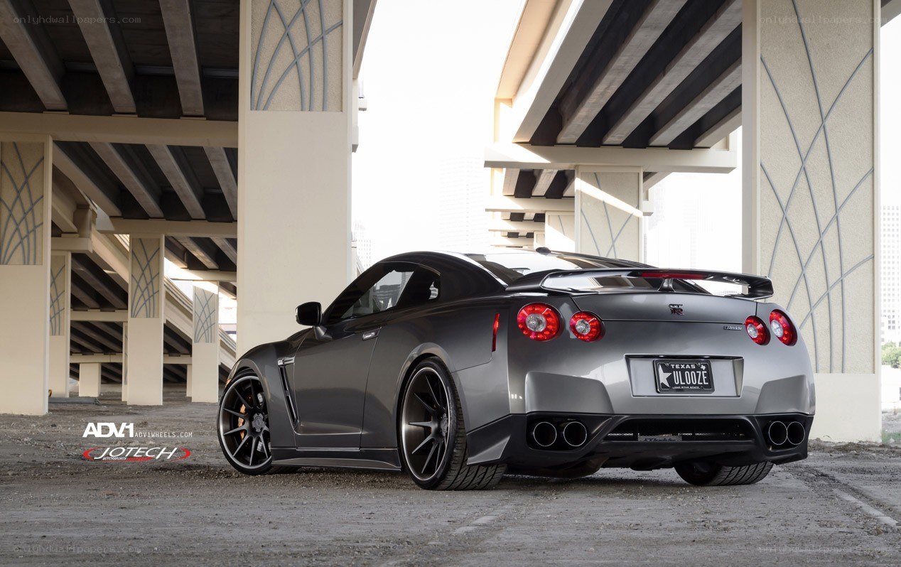 Gray Nissan GT-R under overpass