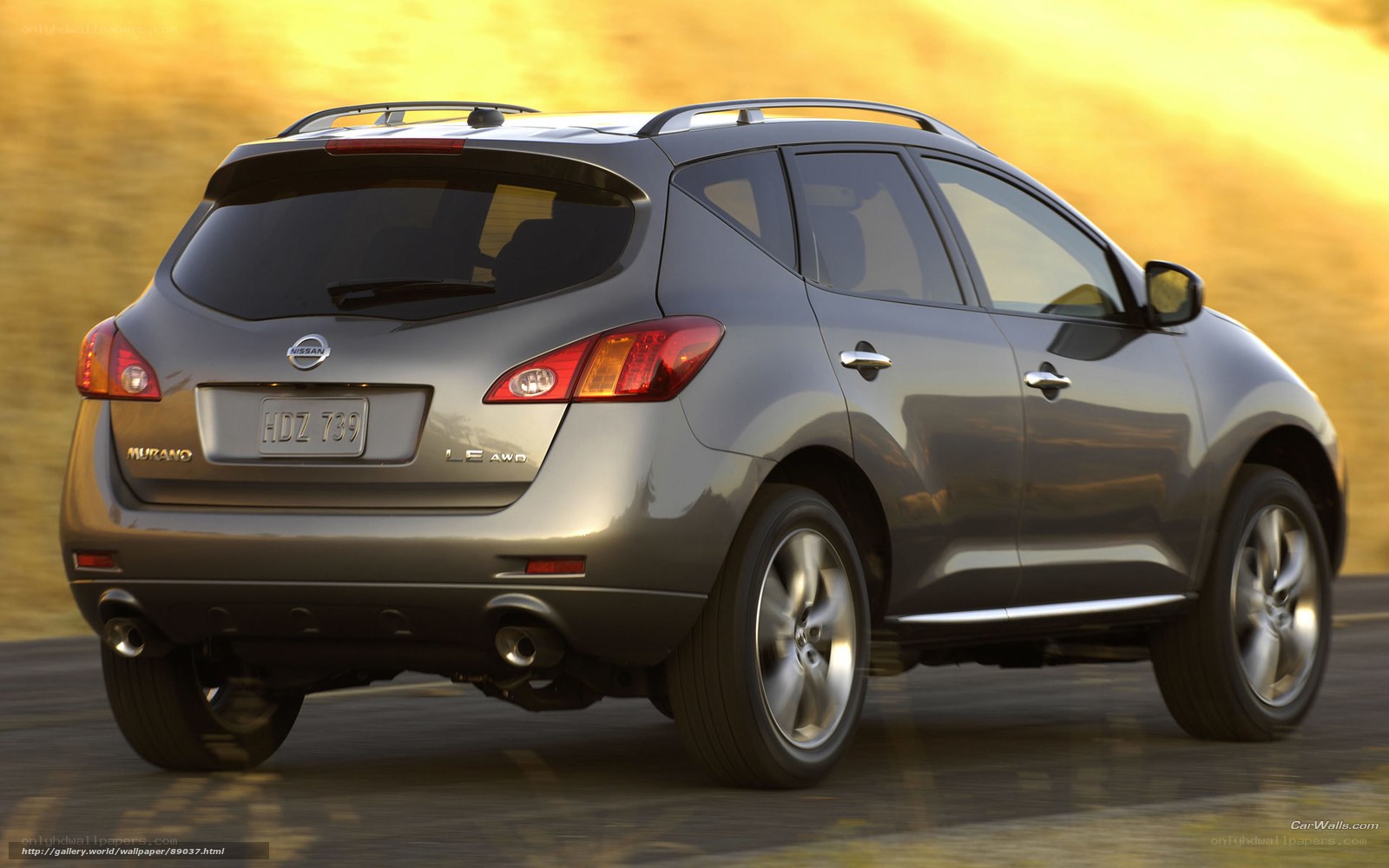 Gray Nissan Murano driving