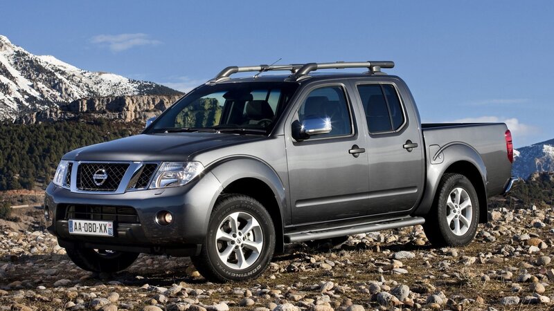 Gray Nissan pickup truck in mountains