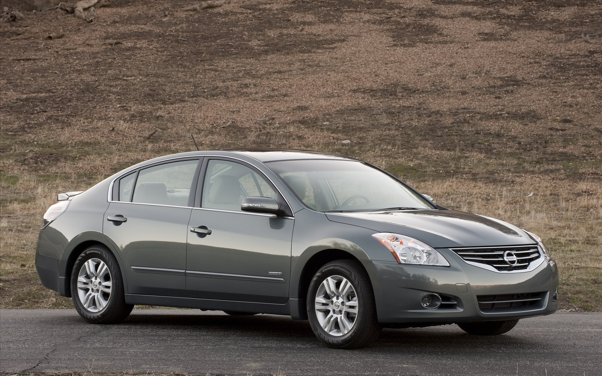 gray nissan sedan on road