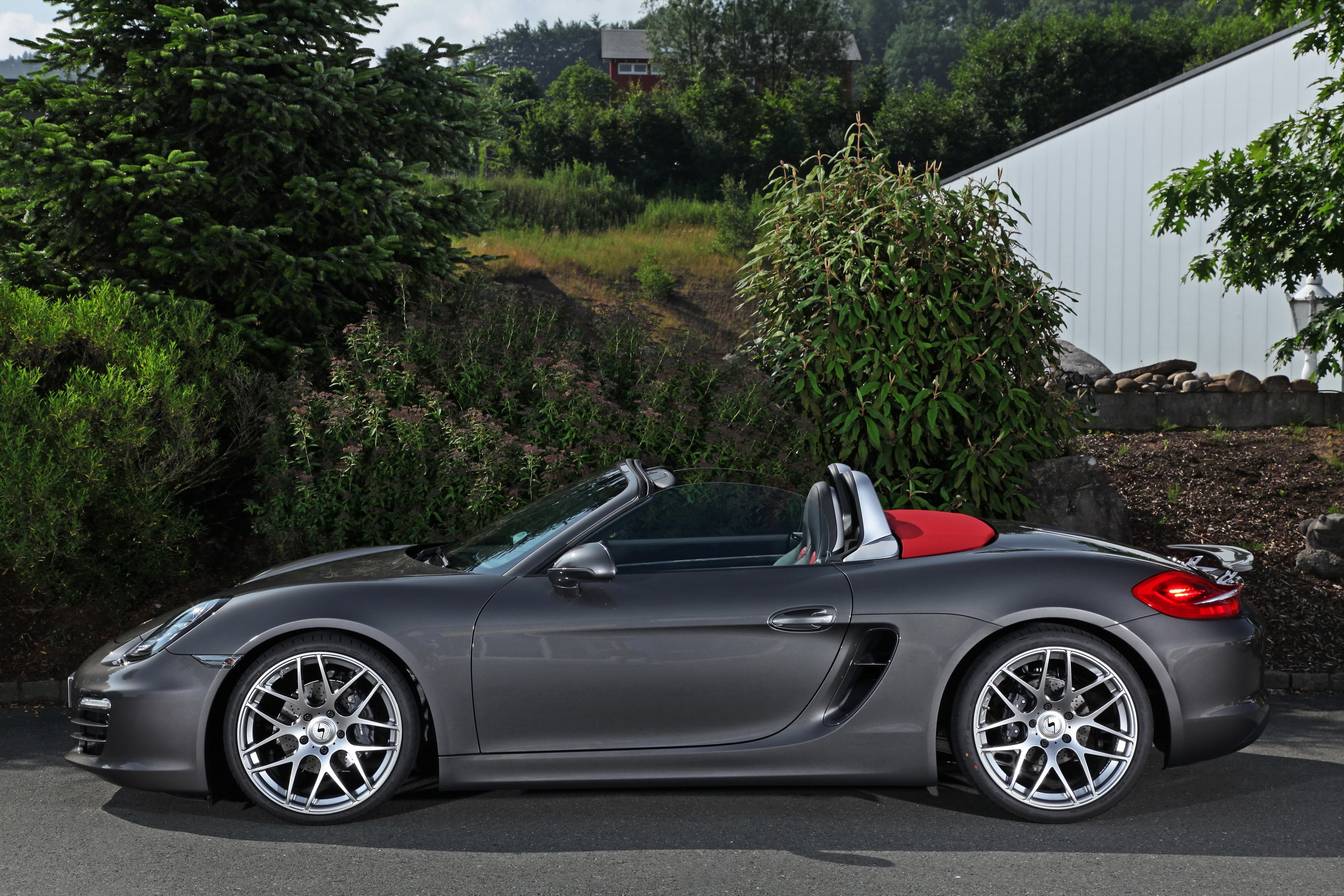 Gray Porsche Boxster parked outside