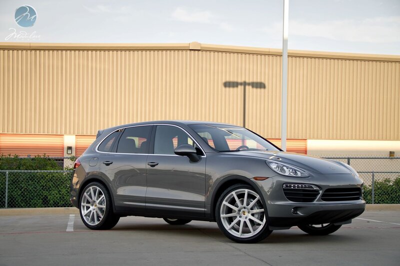Gray Porsche Cayenne parked outside
