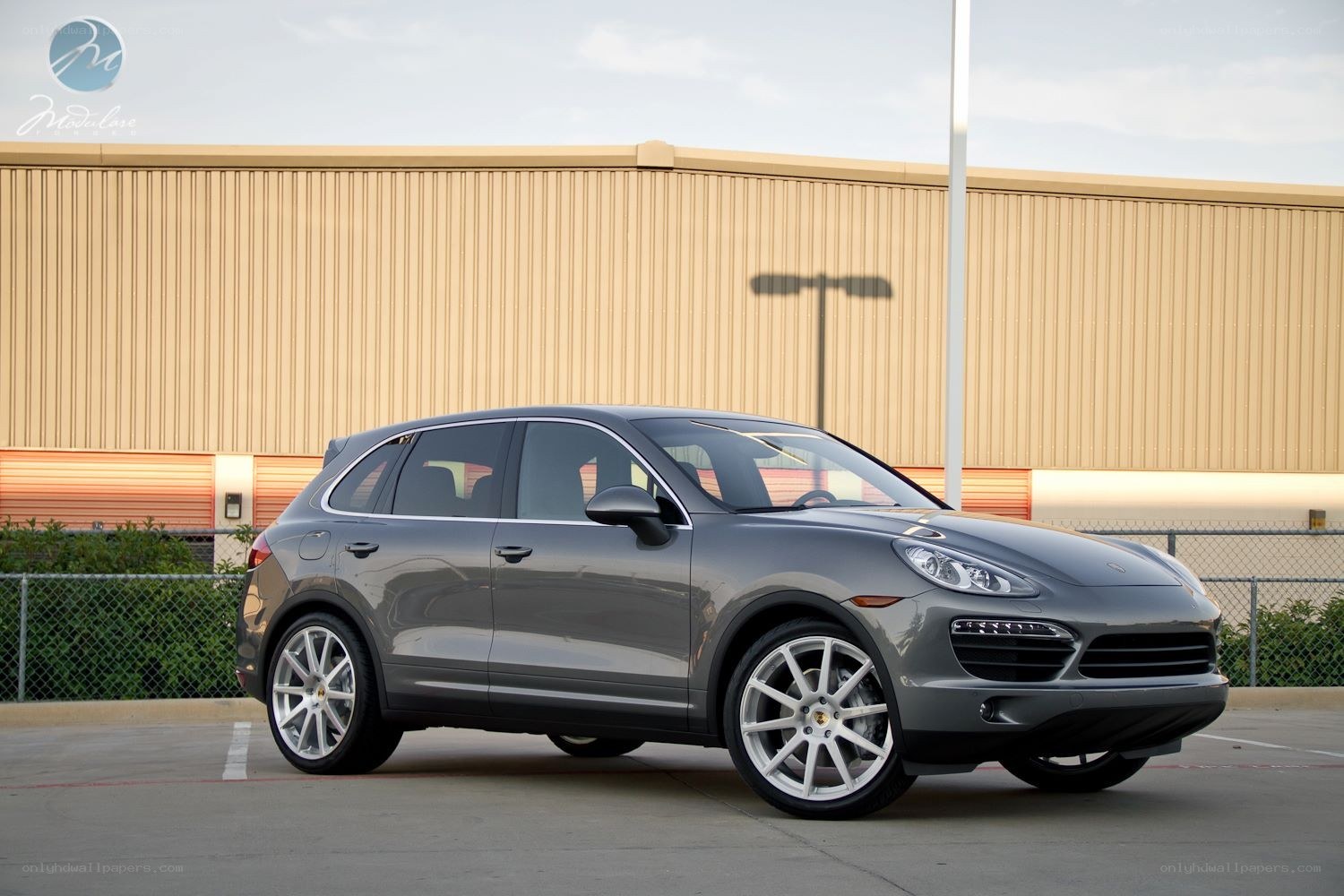 Gray Porsche Cayenne parked outside