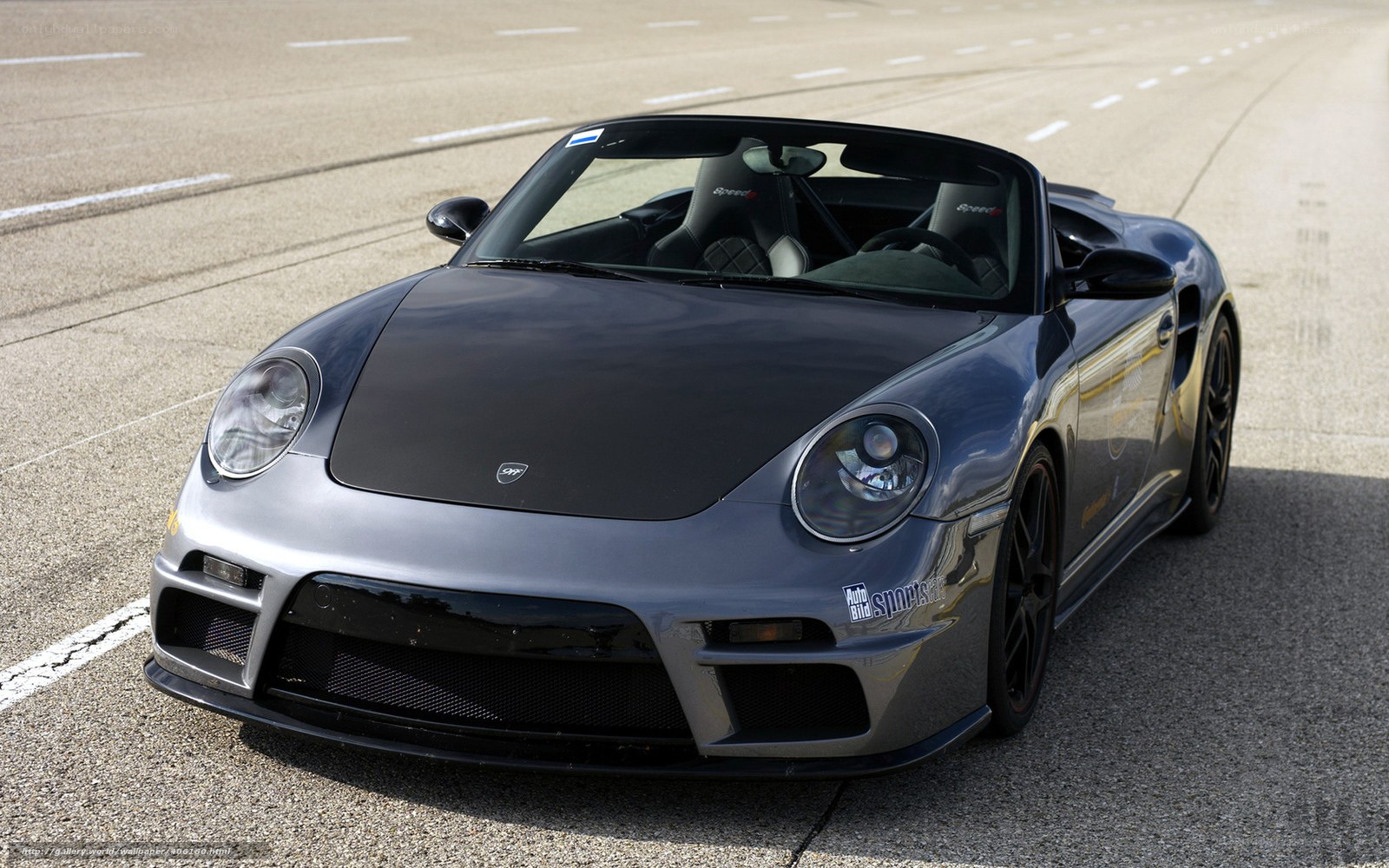 gray porsche convertible on track