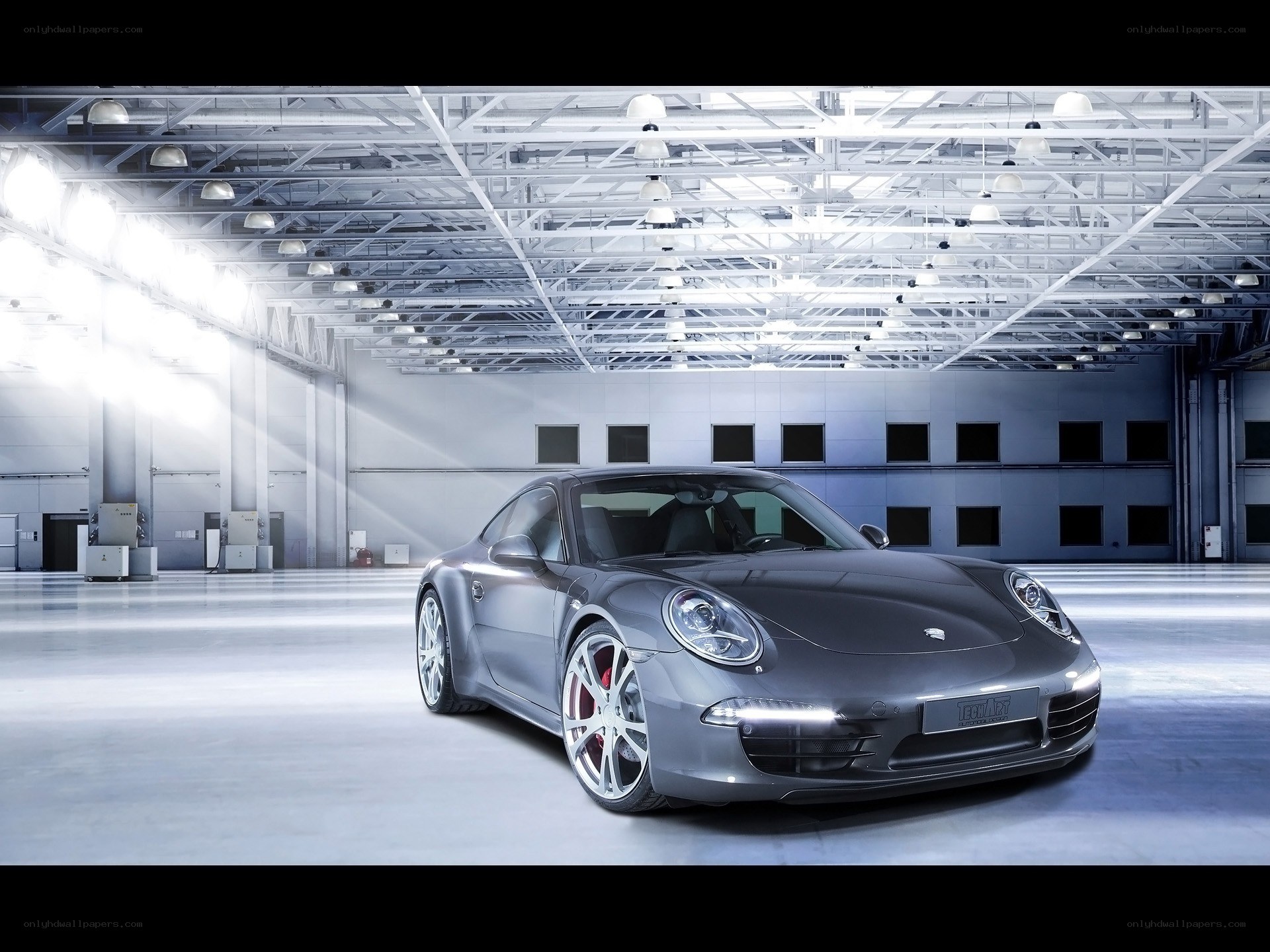 Gray Porsche in a warehouse