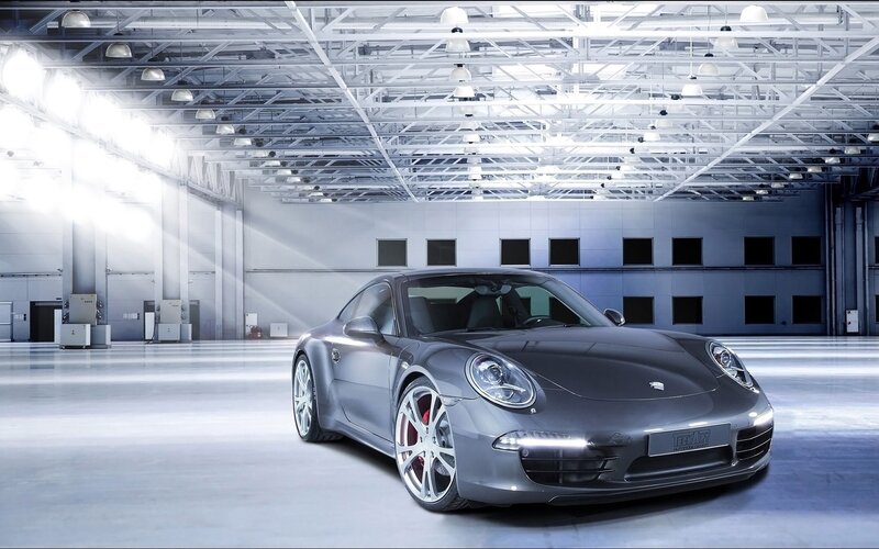 Gray Porsche in a warehouse