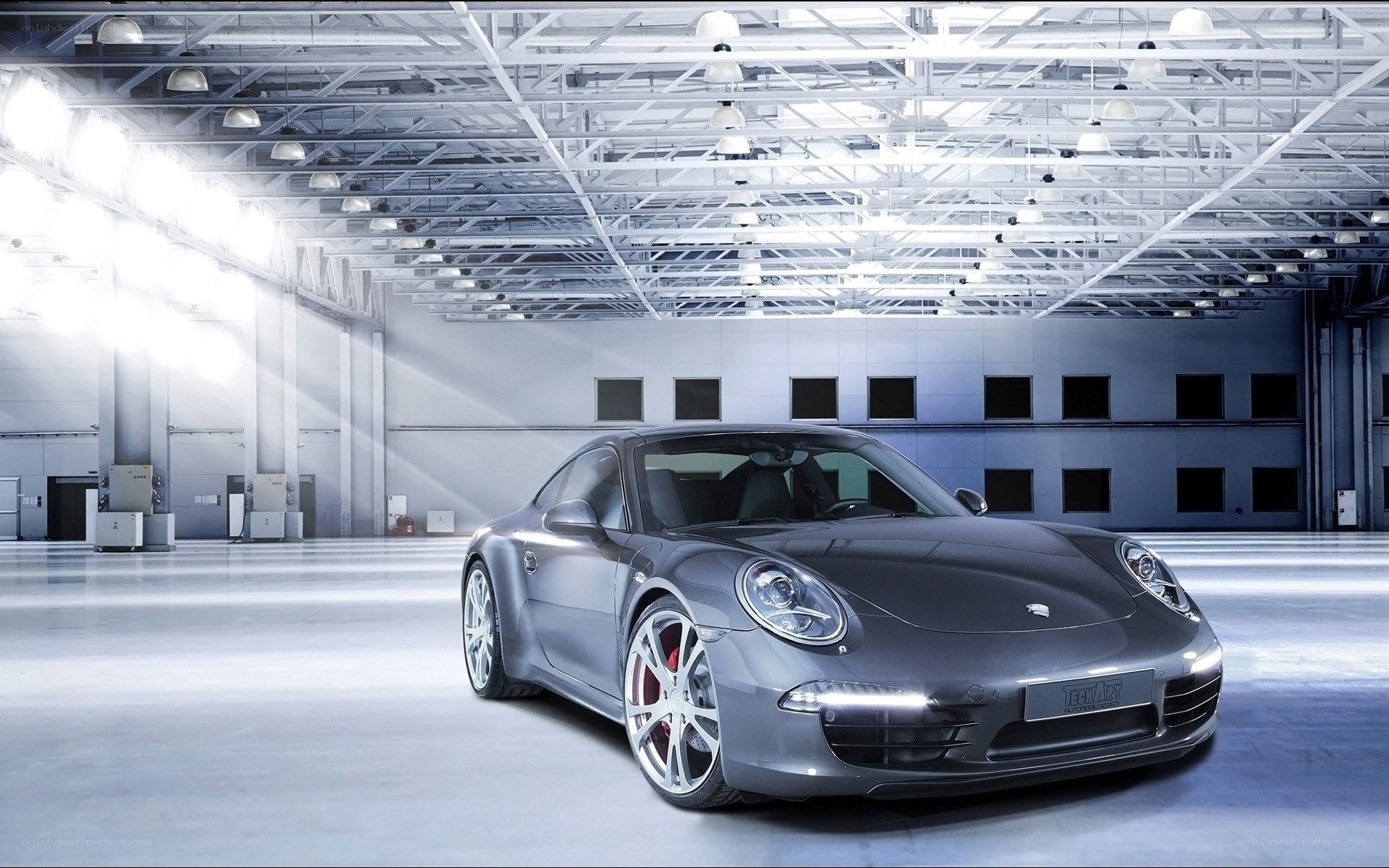 Gray Porsche in a warehouse