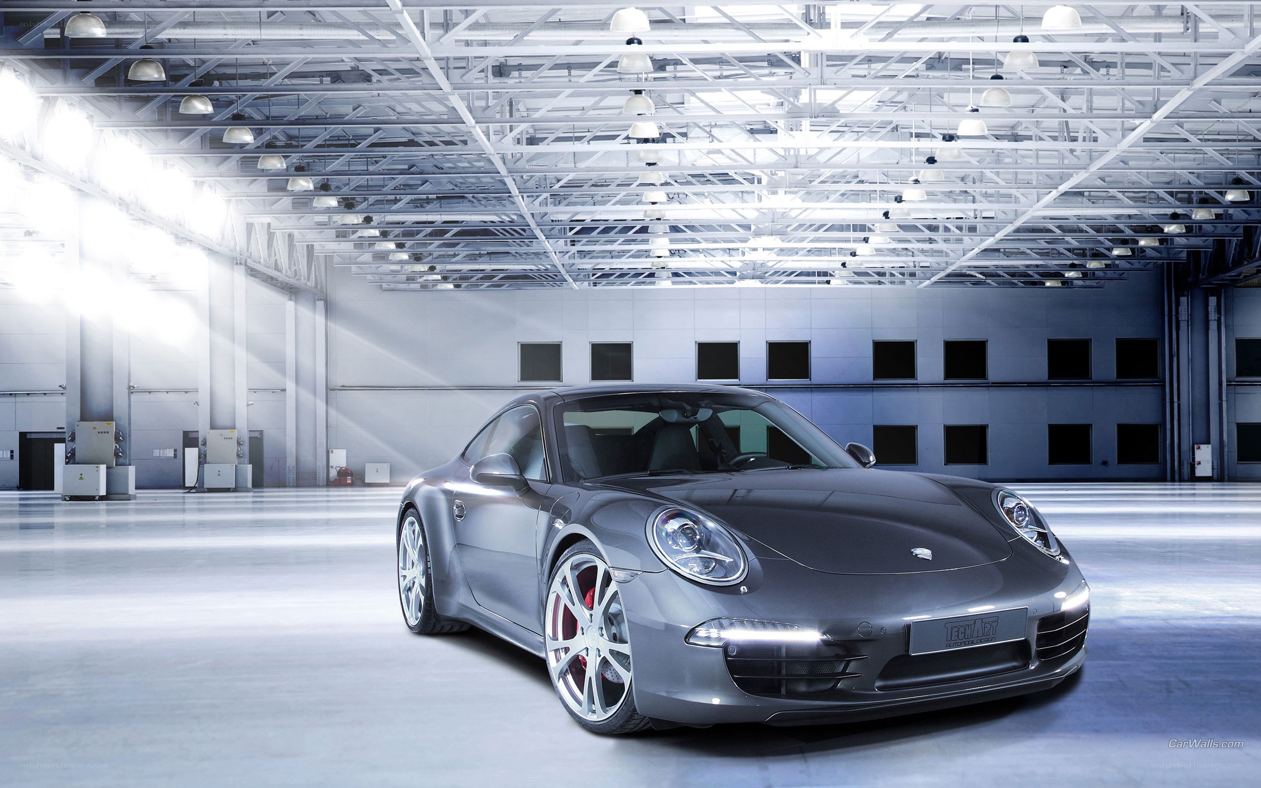 Gray Porsche in a warehouse