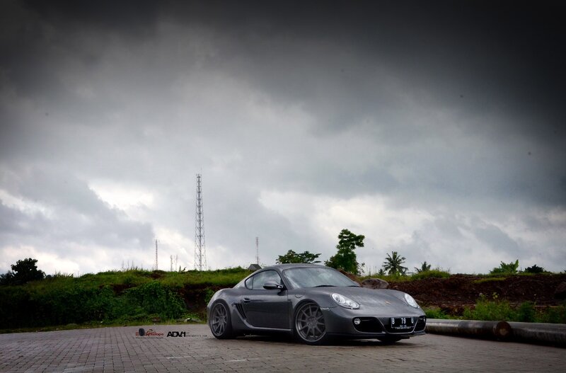 Gray Porsche on a cloudy day