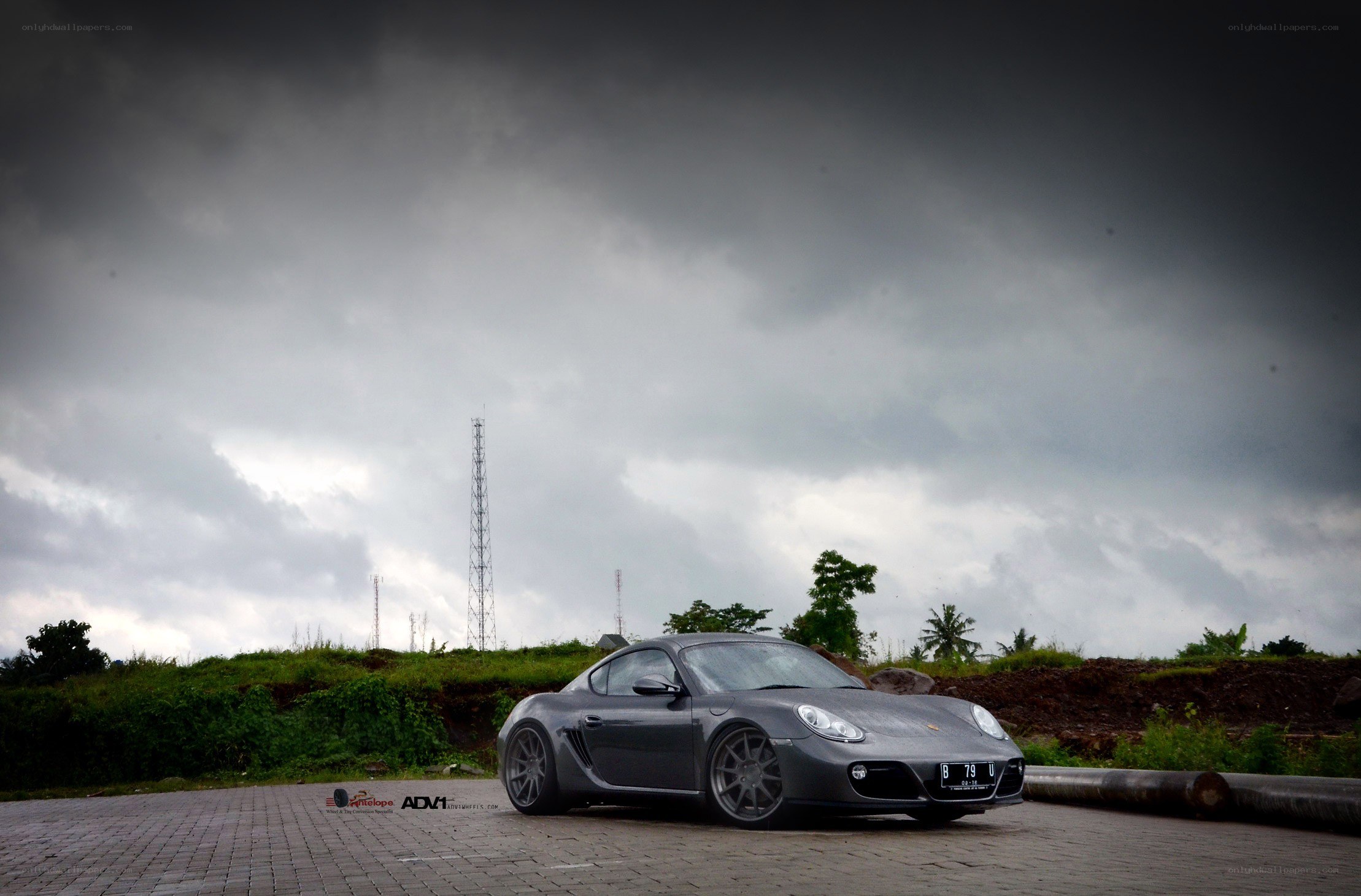 Gray Porsche on a cloudy day