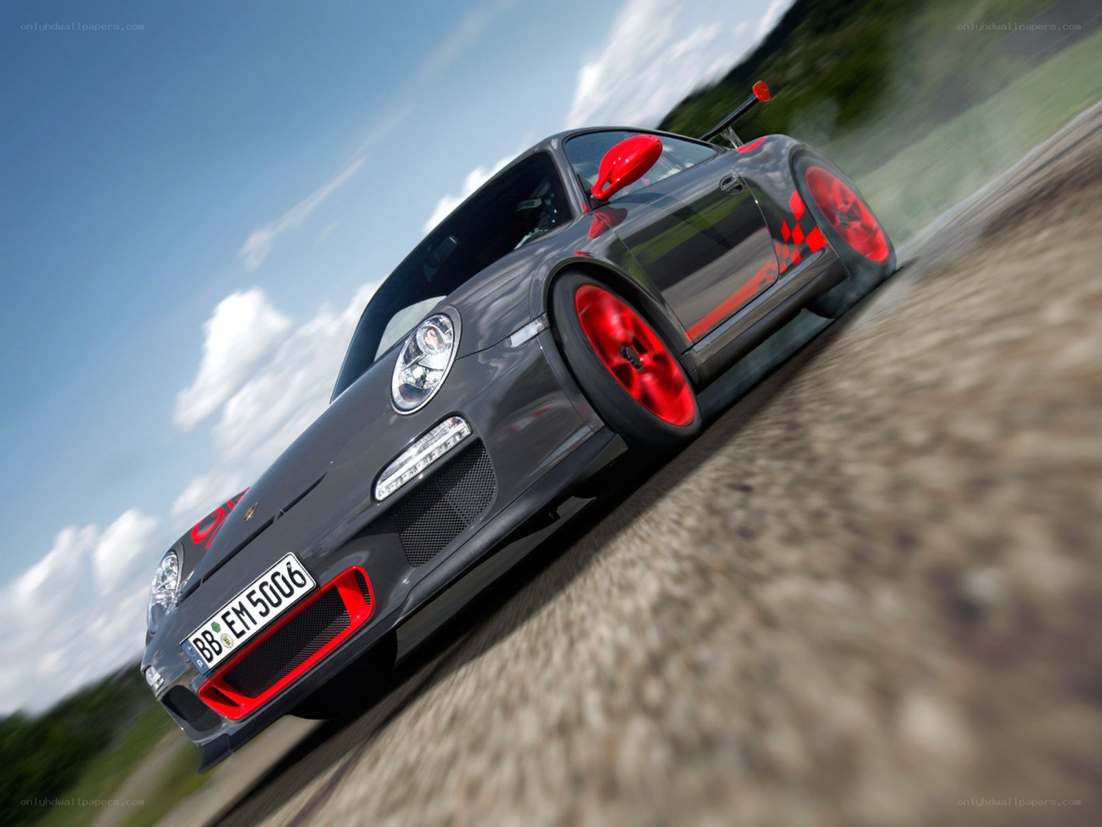 gray porsche on a racetrack