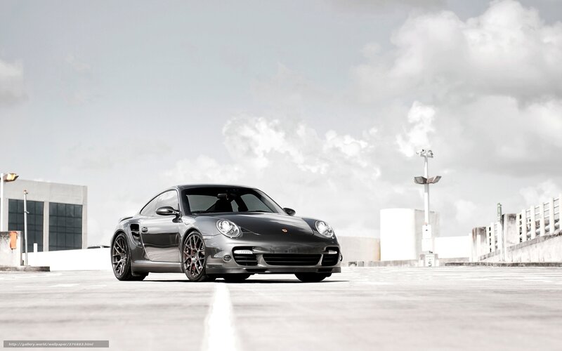 Gray Porsche on a rooftop