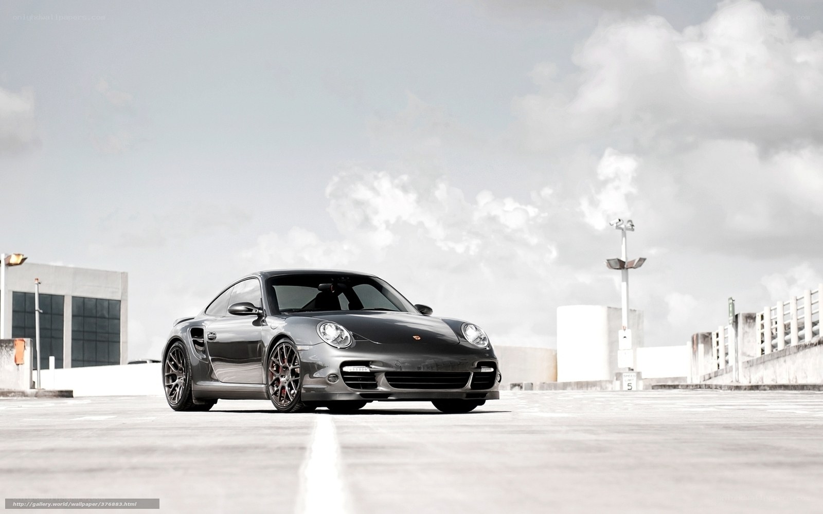 Gray Porsche on a rooftop