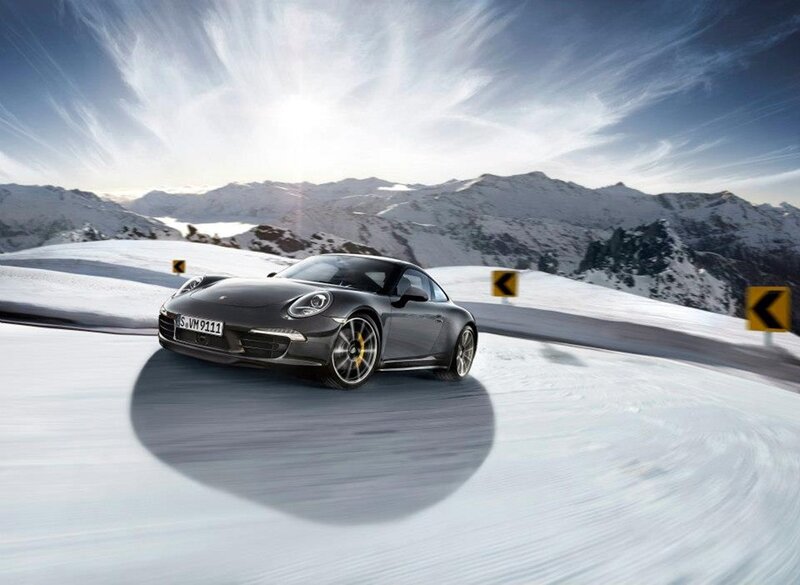 Gray Porsche on Snowy Road