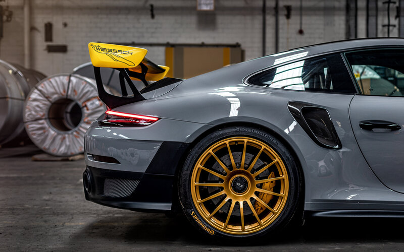 Gray Porsche Sports Car — Dramatic, Photograph, Yellow Rear Wing
