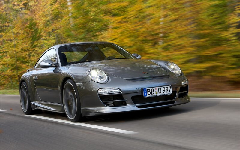 Gray Porsche sports car in motion