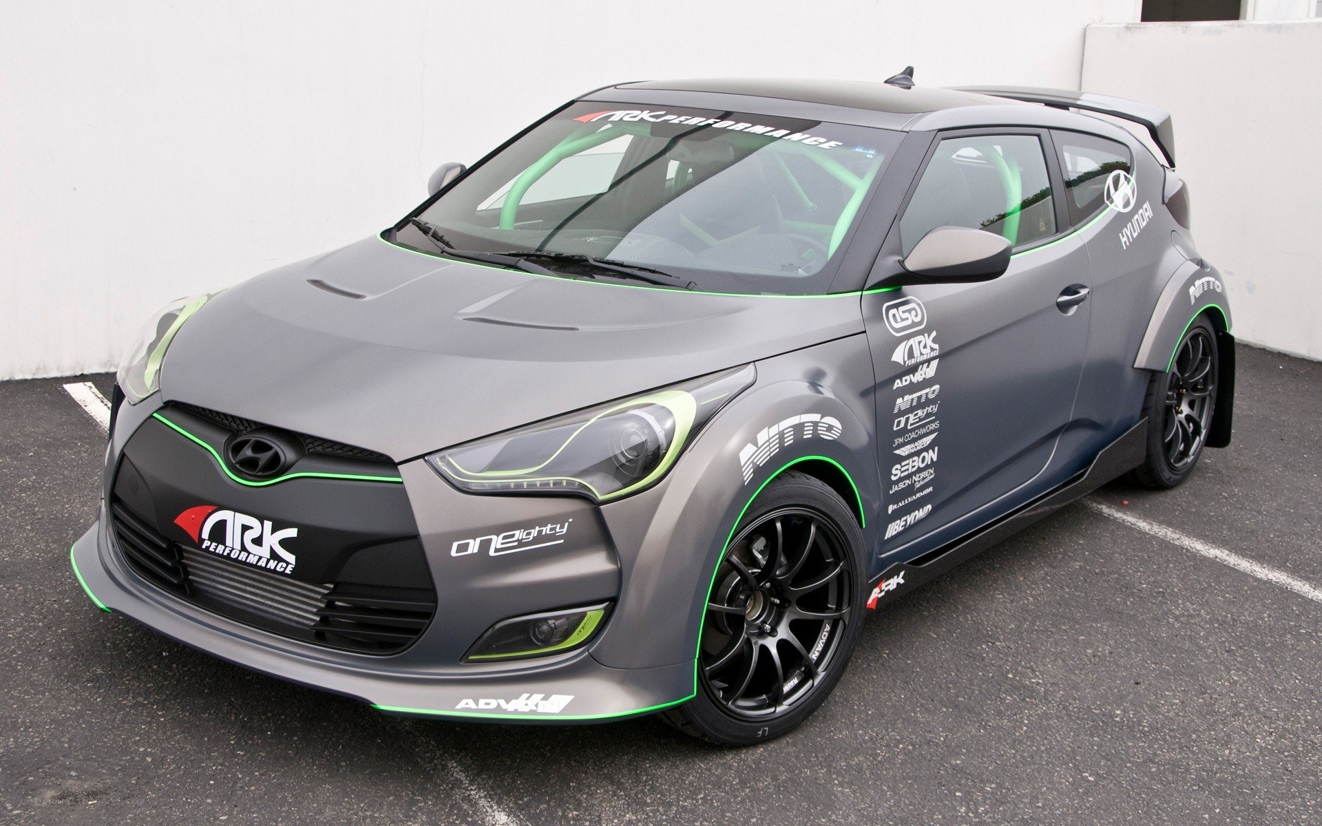 gray race car with green accents