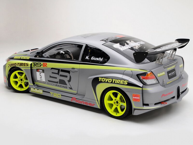 gray race car with neon wheels