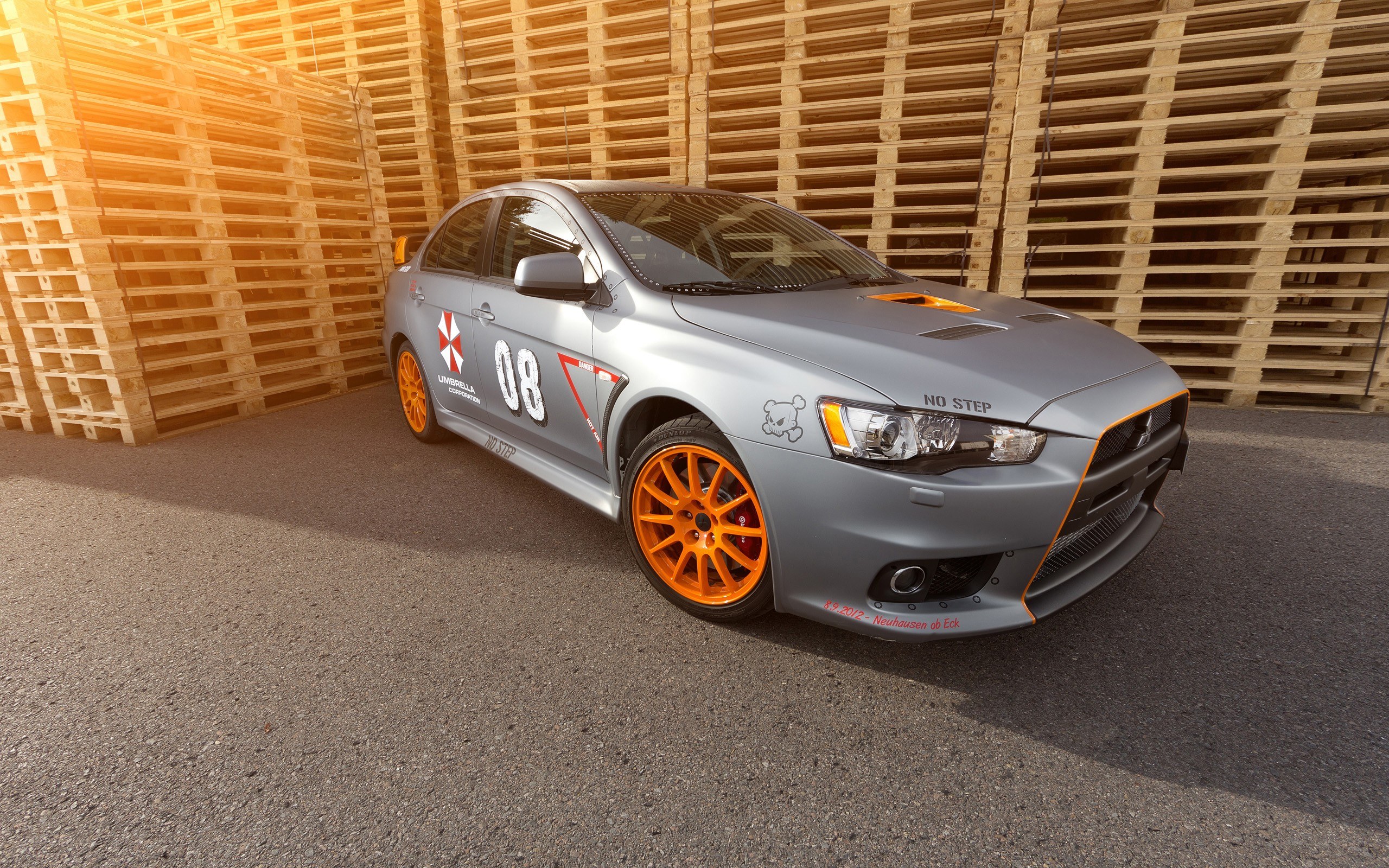 gray race car with orange wheels
