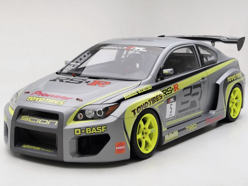 gray race car with yellow accents