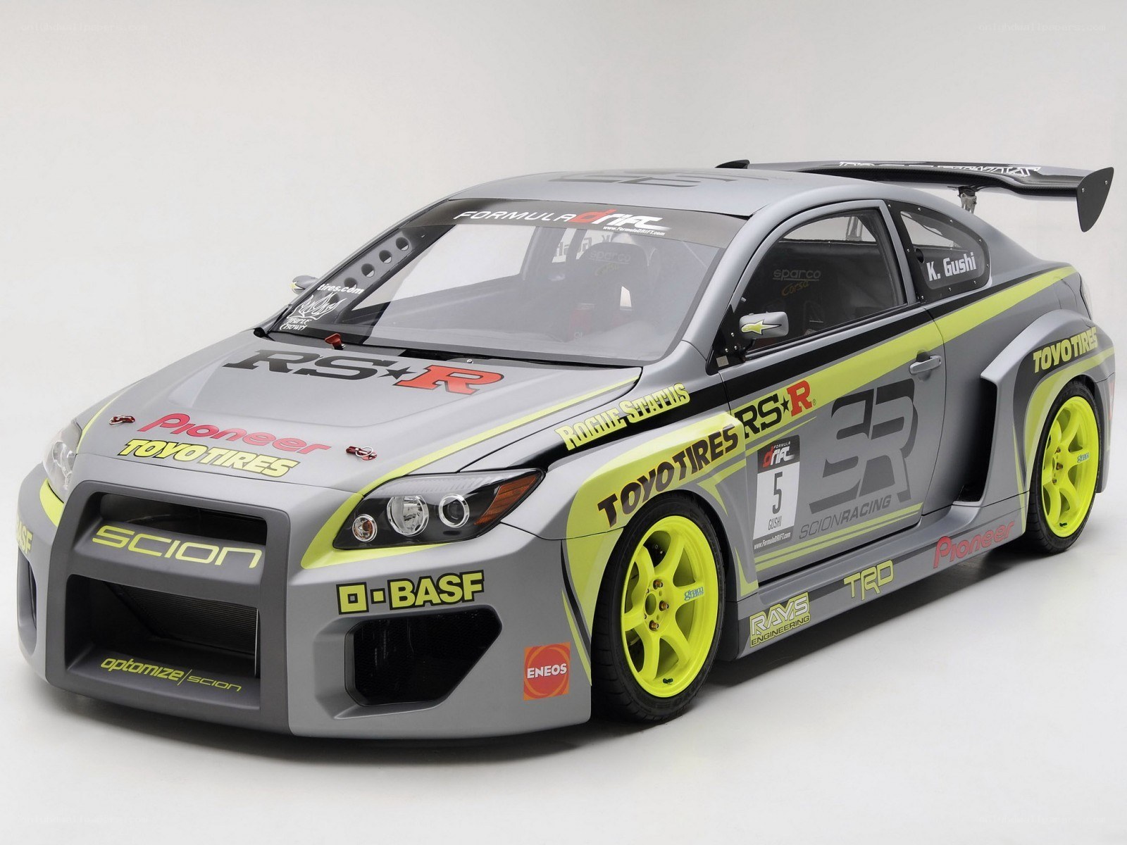 gray race car with yellow accents