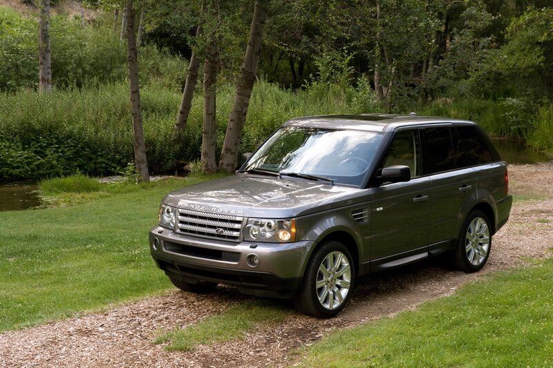 Gray Range Rover in a forest
