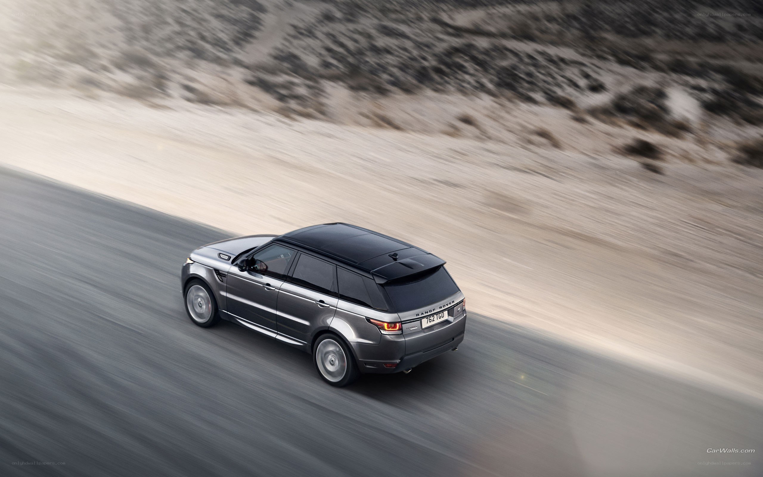 gray range rover in motion