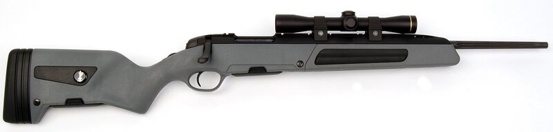 gray rifle with scope