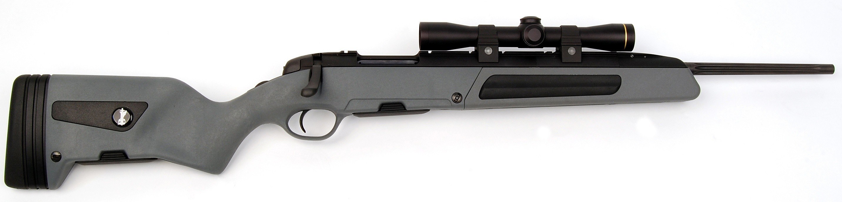 gray rifle with scope