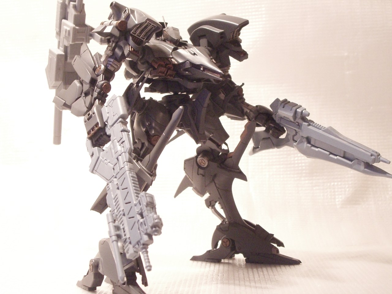 gray robot model with weapons