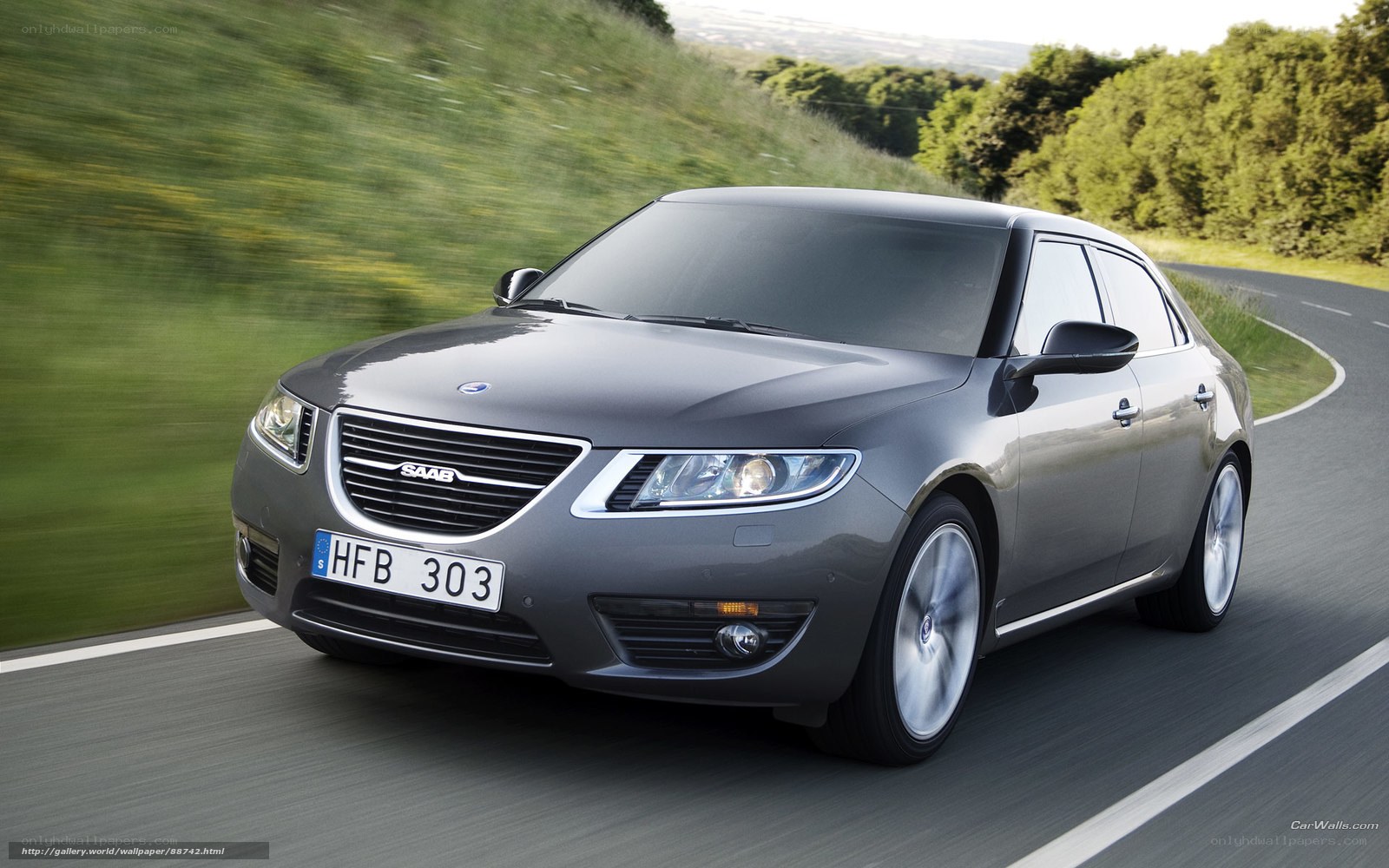 Gray Saab sedan on a winding road