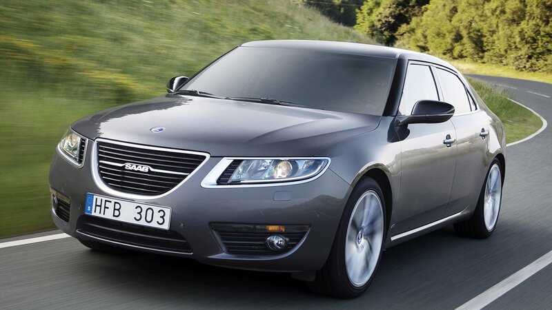 gray saab sedan on road