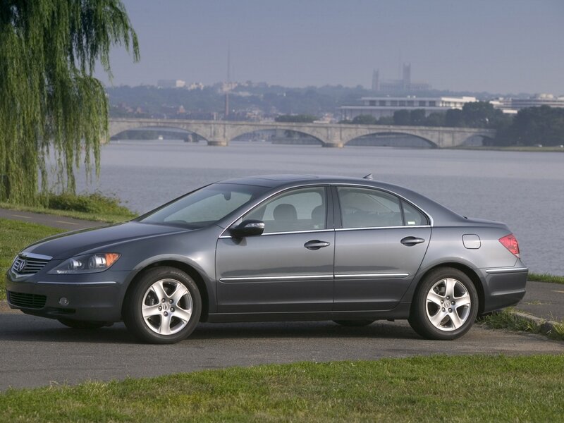 Gray sedan by the river