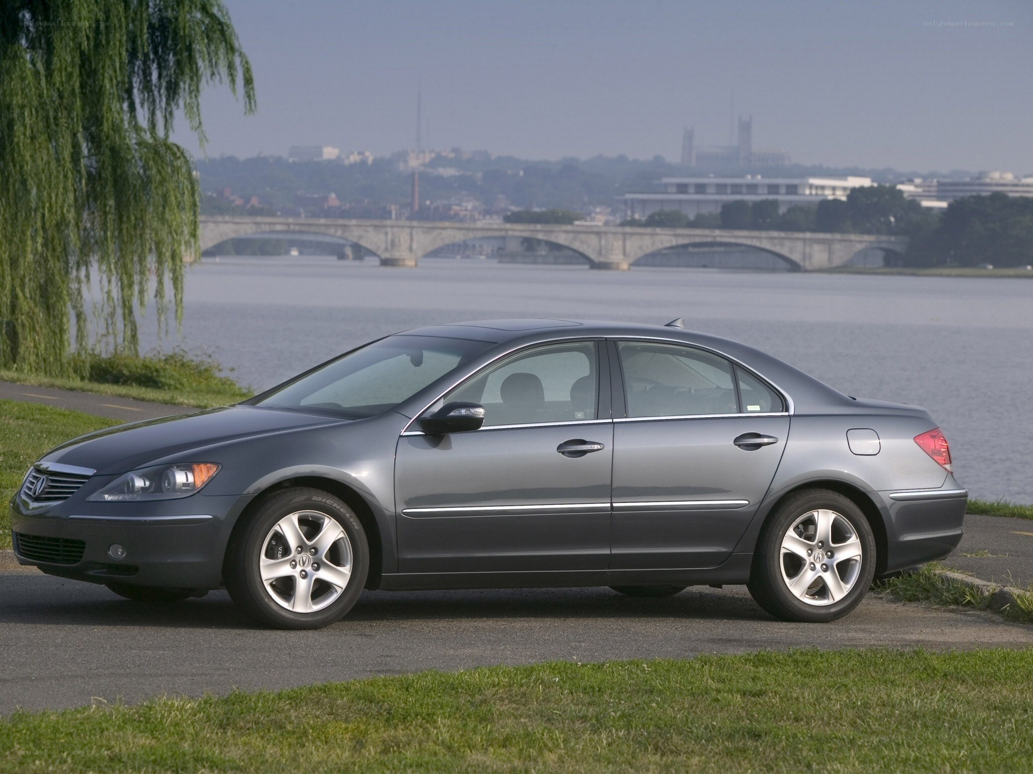 Gray sedan by the river