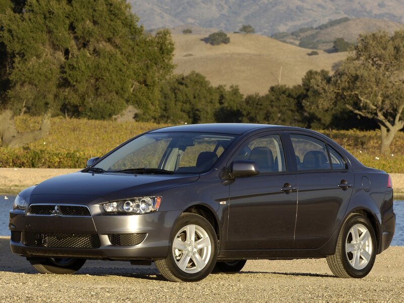 Gray sedan in a scenic landscape