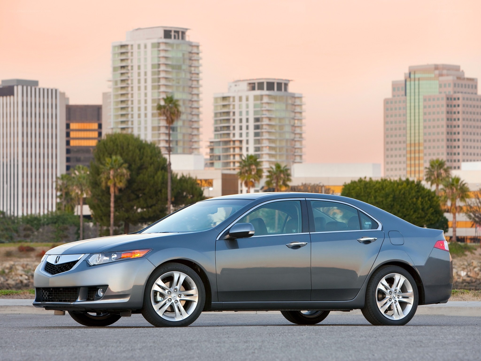 Gray sedan in cityscape