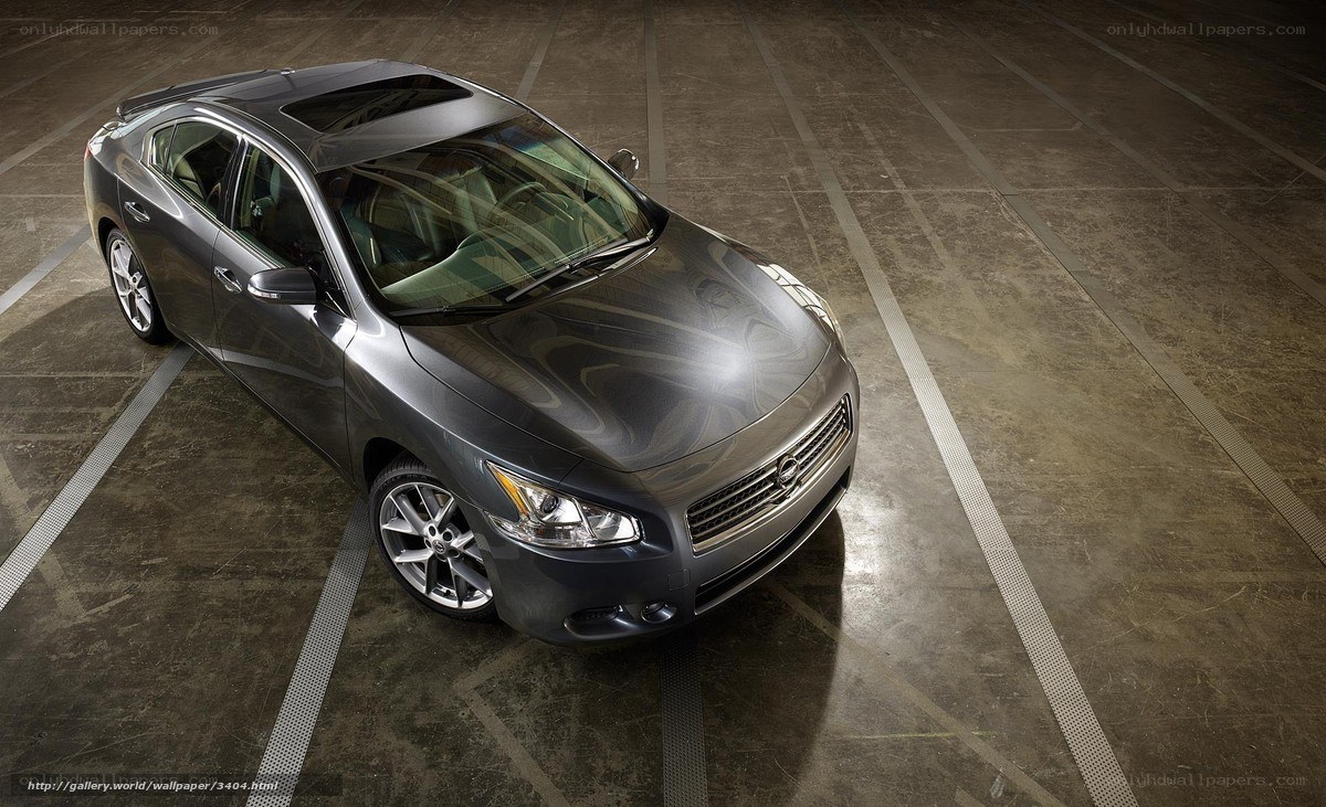 Gray sedan in parking garage