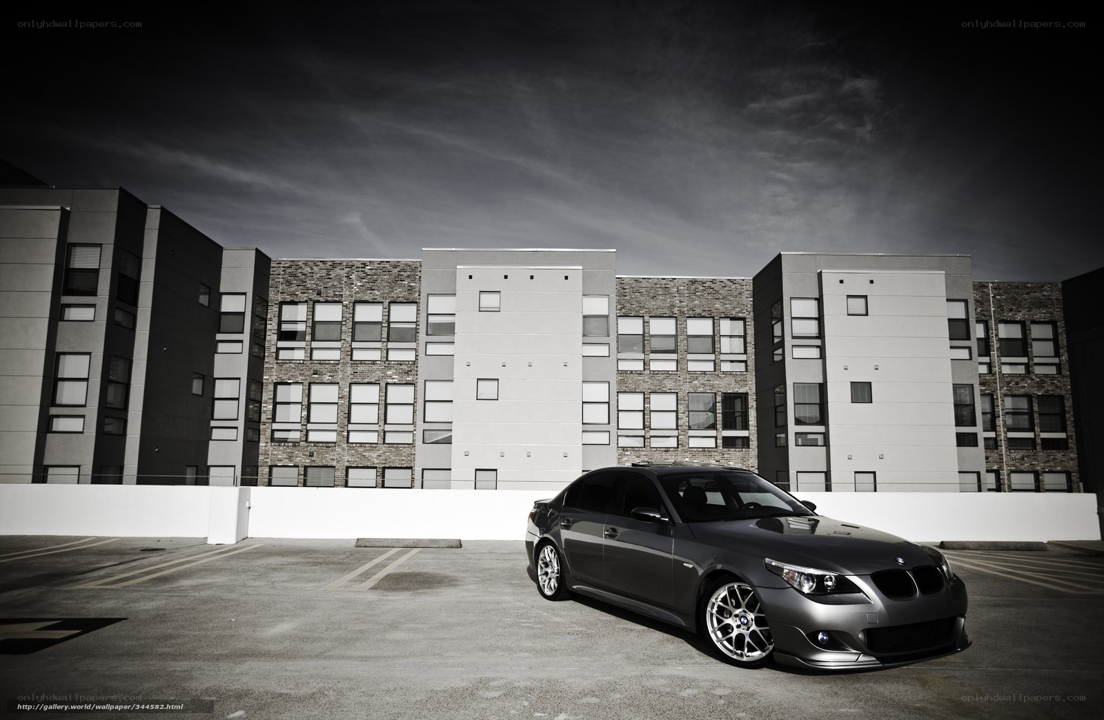 gray sedan in parking lot