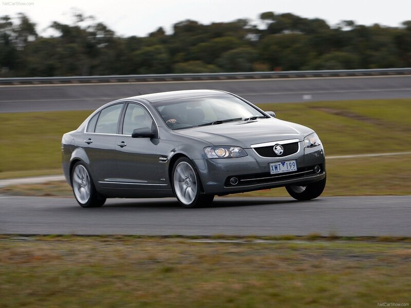 gray sedan on a racetrack