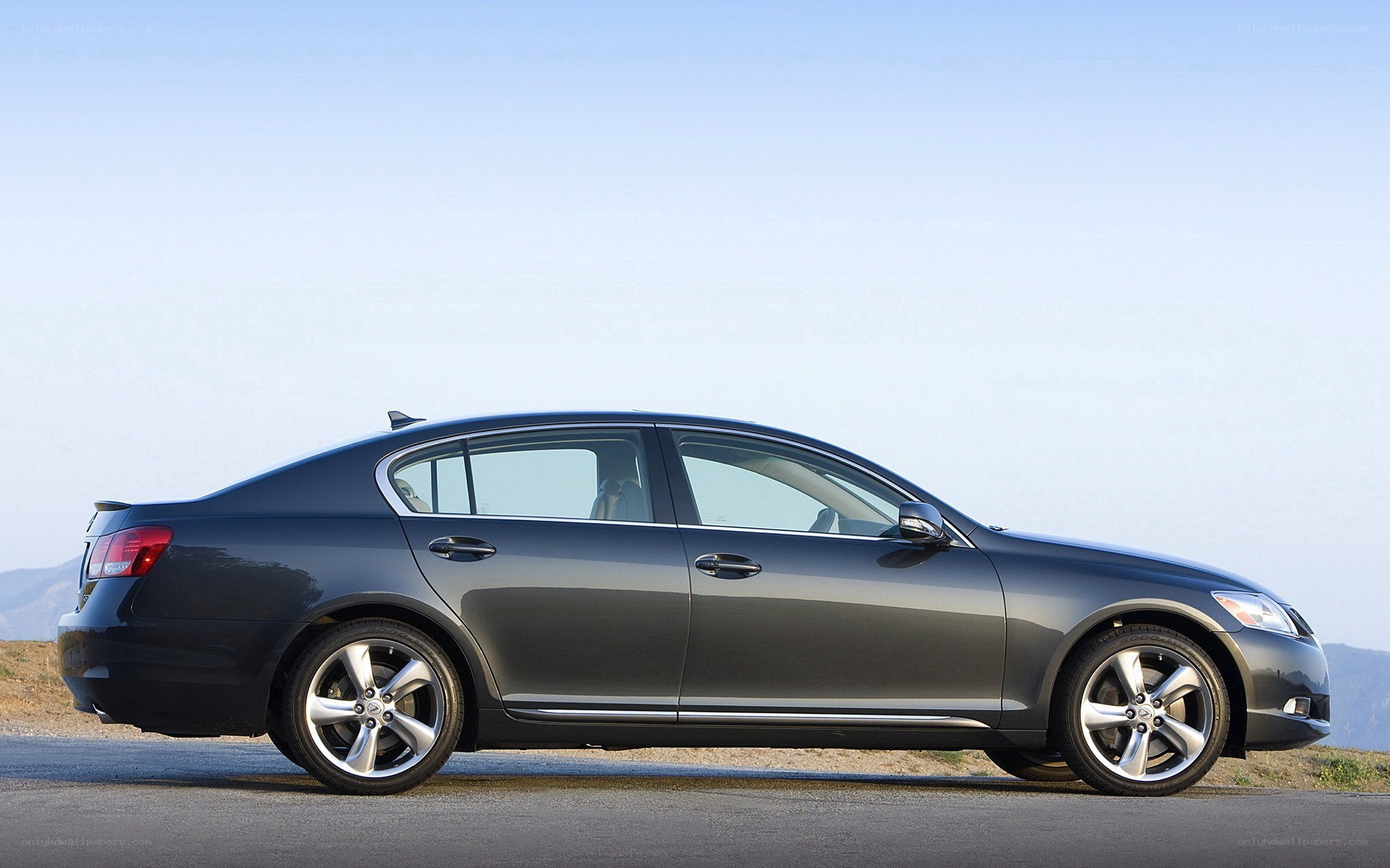 gray sedan on a road