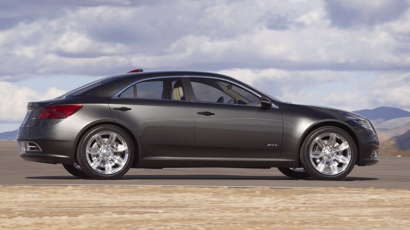 gray sedan on desert road