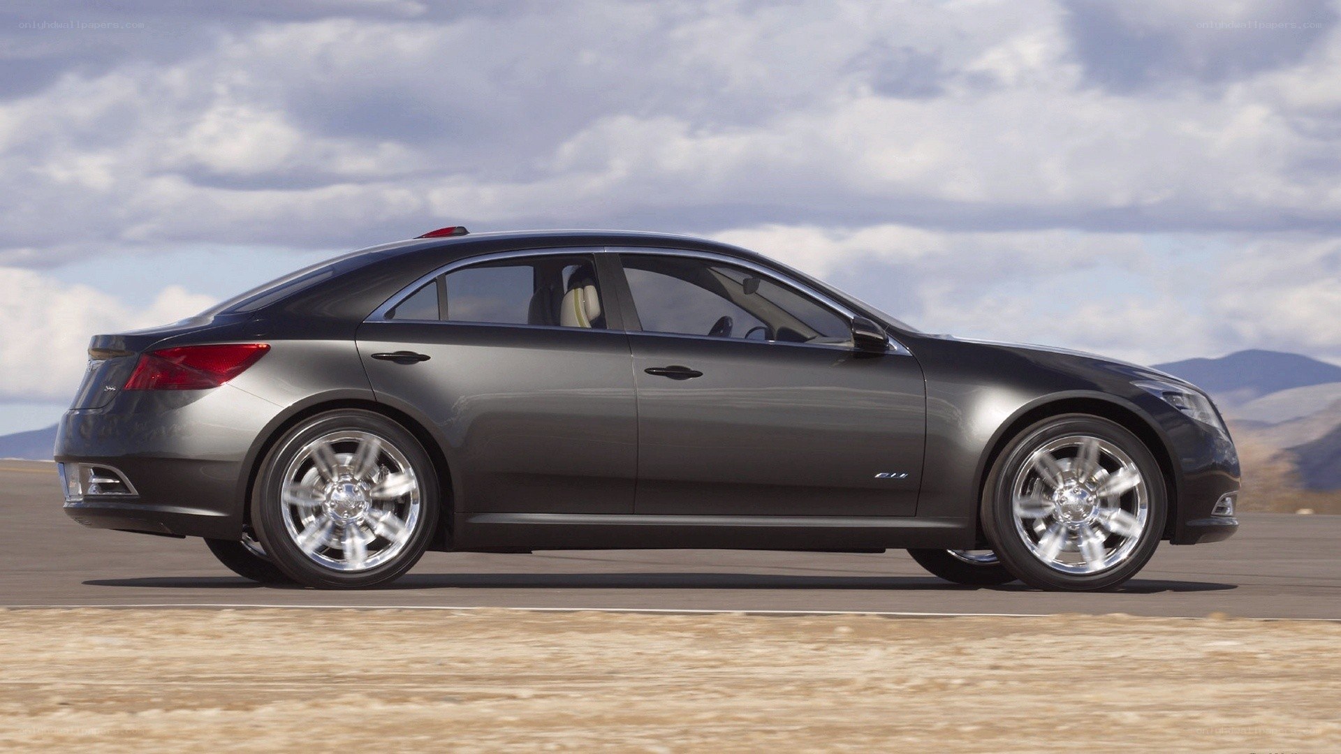 gray sedan on desert road