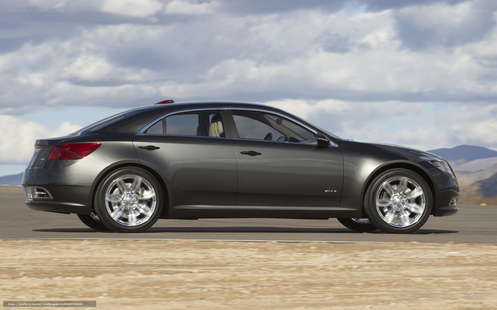 gray sedan on desert road