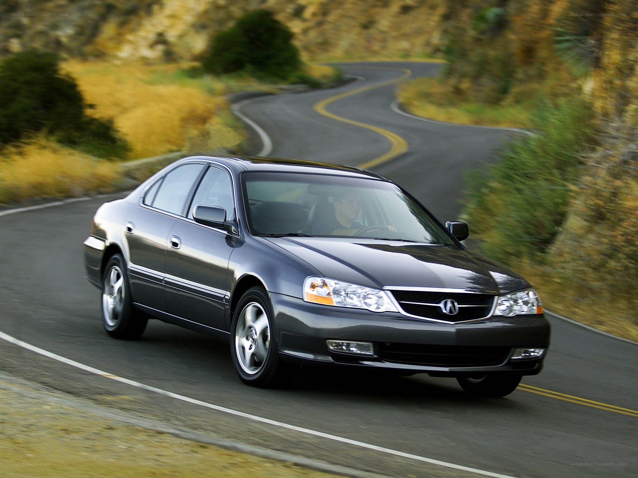 gray sedan on winding road