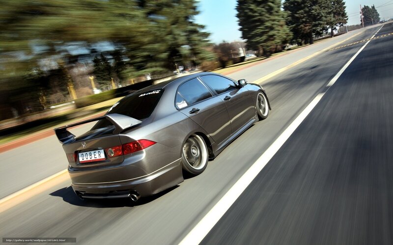 gray sedan speeding on road