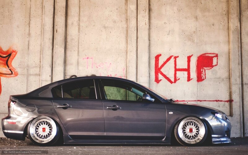 gray sedan with custom wheels
