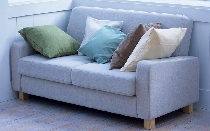 Gray sofa with colorful pillows