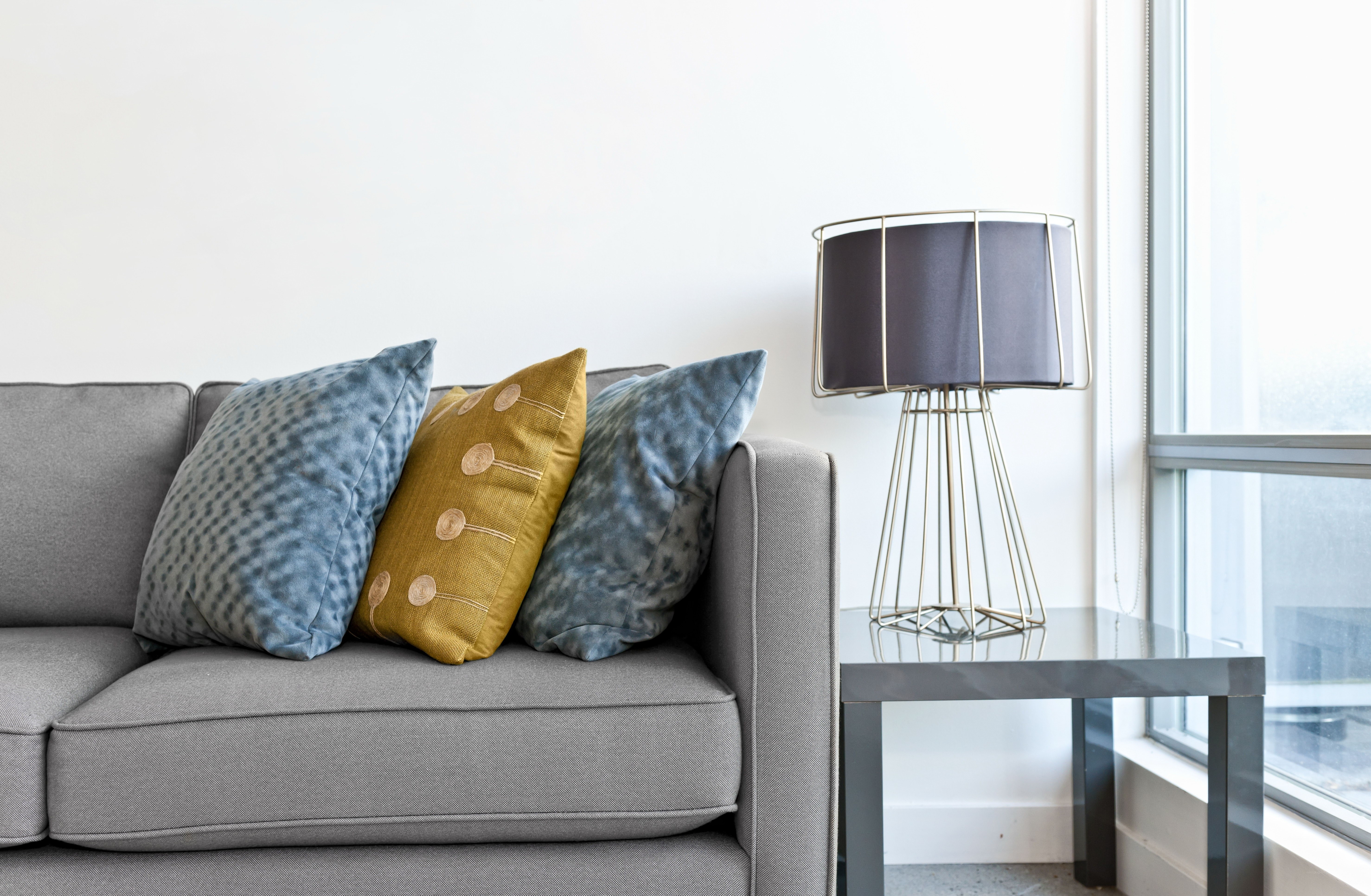 Gray sofa with decorative pillows
