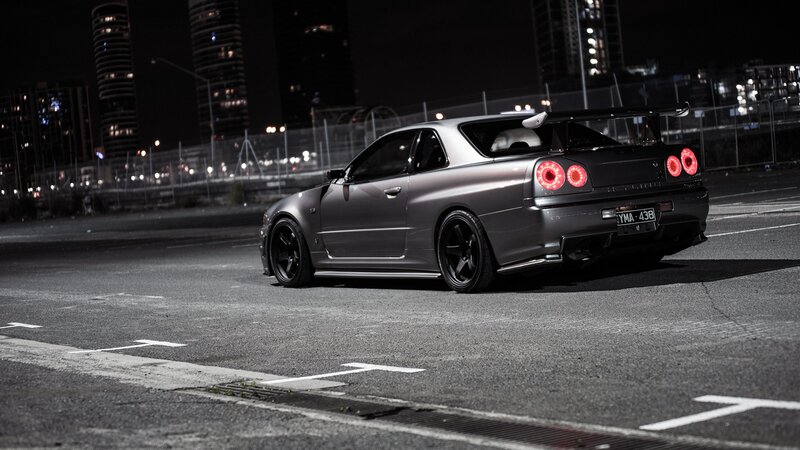 gray sports car at night