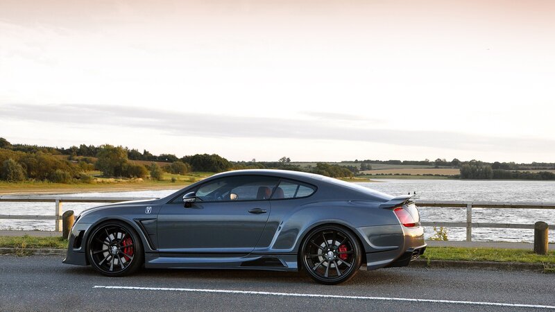 gray sports car by the water